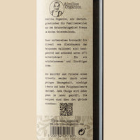 Aimilios Organics 500ml Bio Olivenöl closeup foto rechts vom Etikett auf Kraftpapierbraunem Hintergrund