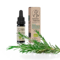 Aimilios Organics Bio Rosmarin Öl auf weißem Hintergrund mit Rosmarin Stängel im Vordergrund